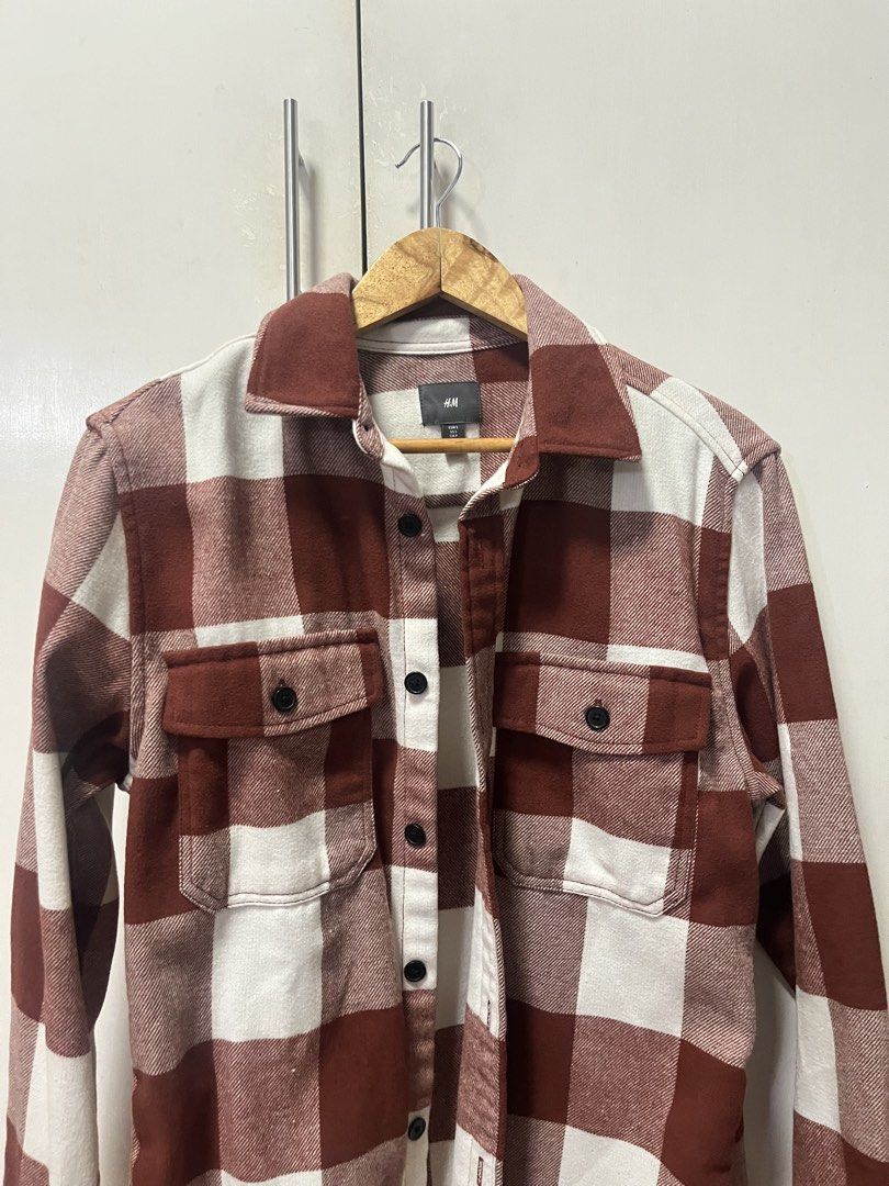 H&M Checkered Long Sleeves (Category: Tshirts & Polo Shirts ) located in Manila. Submitted by jzone05 (Listing ID 1438420507, Image 2). Description: - H&M checkered shirt - Maroon and white - Size S - Button-down front - Two chest pockets - Collared neckline - Thick material (possibly flannel) - Versatile for layering or standalone wear.