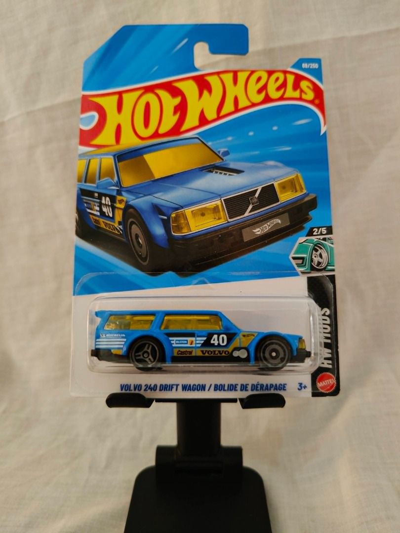 Hot Wheels Volvo 240 Drift Wagon (Category: Vehicle & Diecast Models) located in Tanauan. Submitted by jaseqwertyy (Listing ID 1438324228, Image 1). Description: - Hot Wheels Volvo 240 Drift Wagon - Blue with yellow accents - Features the number 40 - Part of the HW Mods series - 2/5 in the series - Hidden Bonus Feature: With Dogs at the back of the wagon - Collectible item - Meetup Only; Tanauan Exit (7-Eleven, Jollibee, McDo, Shell).
