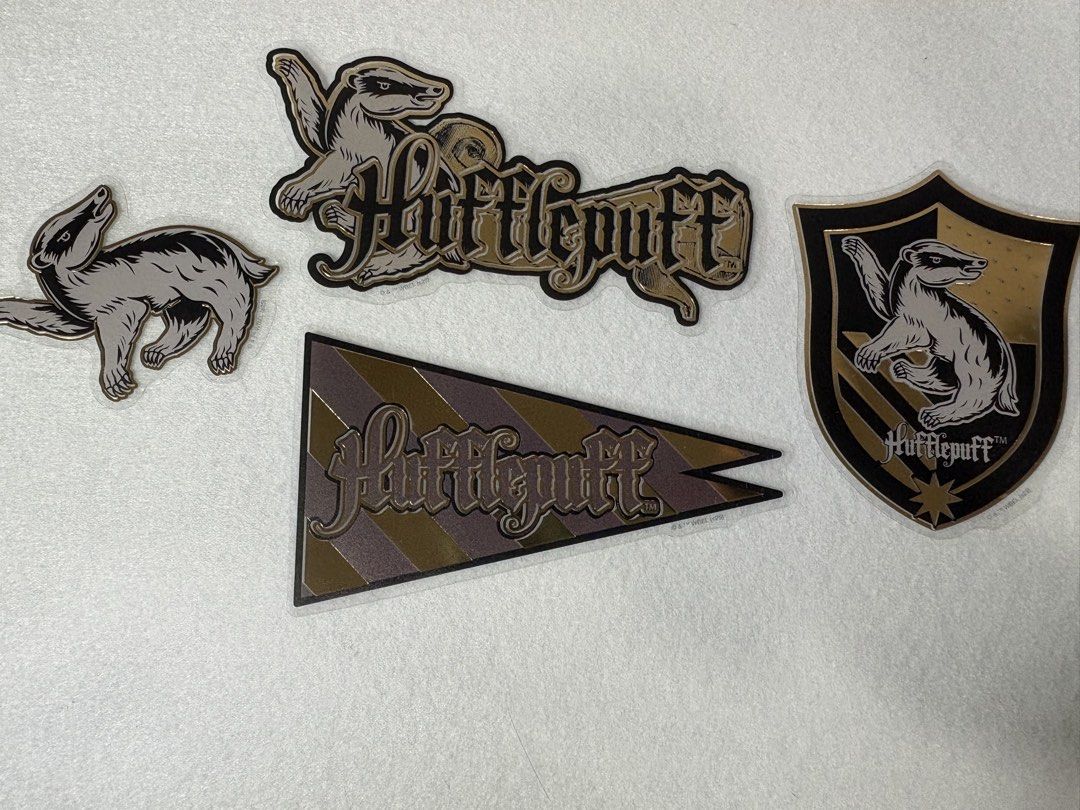 Hufflepuff Stickers Set (Category: Storybooks) located in San Fernando. Submitted by sammypgirl (Listing ID 1438488865, Image 1). Description: - Hufflepuff sticker set - Features the house crest and badger designs - Includes a banner-shaped sticker - Perfect for Harry Potter fans - Ideal for laptops, notebooks, and smooth surfaces.