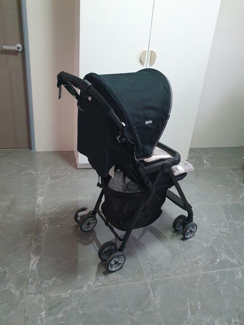 Joie Juva Stroller (Category: Strollers) located in Calamba. Submitted by tin1904 (Listing ID 1438338707, Image 3). Description: - Joie stroller with a sleek black frame and canopy. - Convenient storage basket underneath. - Easily foldable for compact storage and transport. - Designed with multiple wheels for enhanced stability and maneuverability. - RFS: No longer being used. .