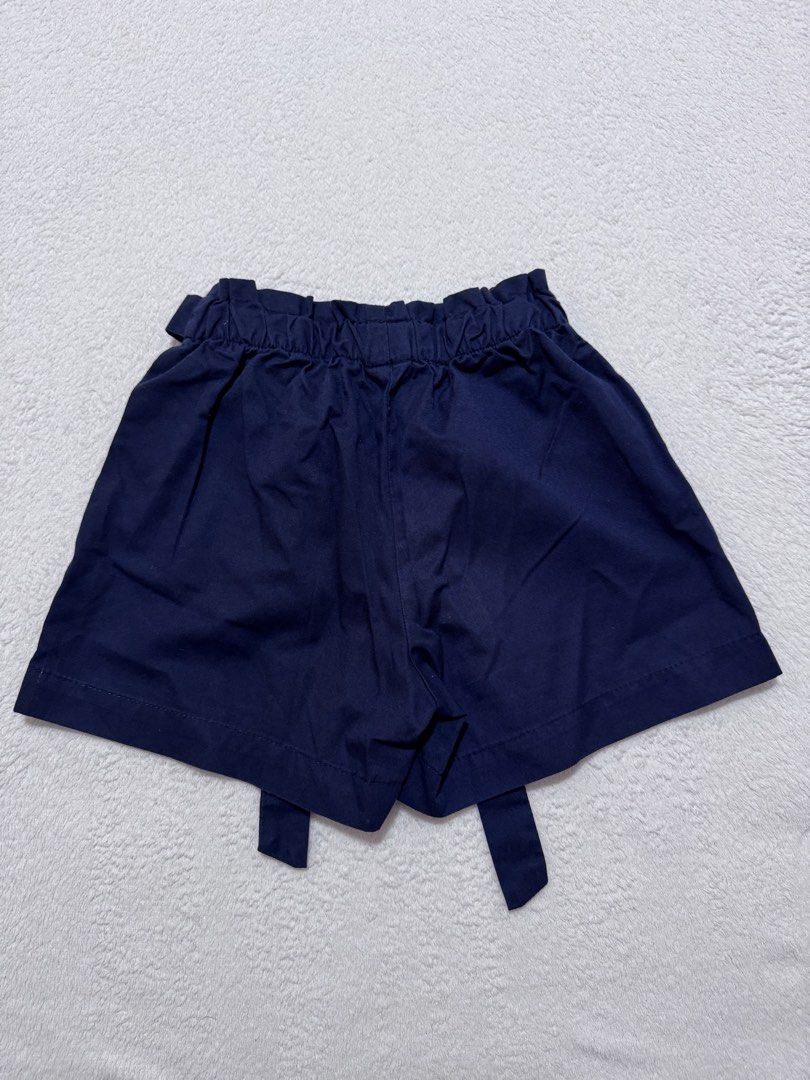 Just Jeans Navy Shorts Size 8 (Category: Shorts) located in Mandaluyong City. Submitted by toront0427 (Listing ID 1438474887, Image 2). Description: - Just Jeans navy shorts - Size 8 - Paper bag waist with matching tie - Solid navy color - Cotton blend material - Pockets.