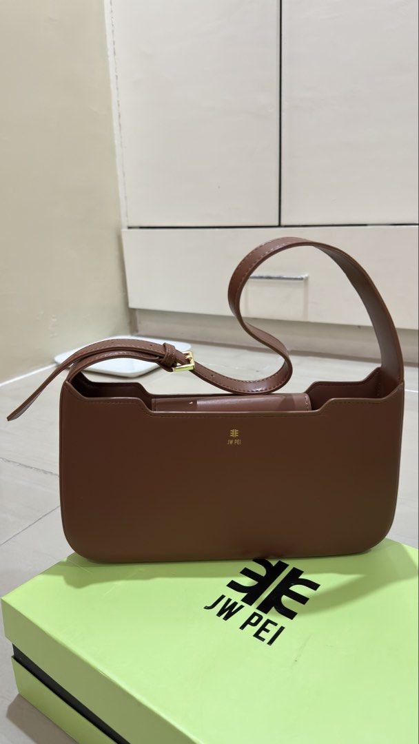 JW PEI Millie Shoulder Bag - Brown (Category: Shoulder Bags) located in Manila. Submitted by ymonavera68928 (Listing ID 1438357288, Image 1). Description: JW PEI Shoulder Bag – Brown Selling this authentic JW PEI shoulder bag in excellent condition. * Color: Brown * Condition: Lightly used/ Like New * Adjustable shoulder strap * Structured design * Comes with original box RFS: Rarely used, decluttering..