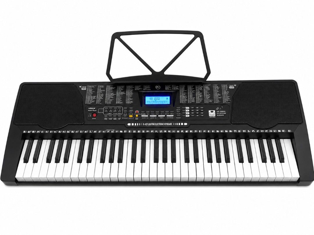 K-7700 Electronic Keyboard (Category: Computer Keyboard) located in Makati City. Submitted by grande.taille.by.ab (Listing ID 1438389965, Image 2). Description: - Electronic keyboard with built-in music stand - Features a display screen and function buttons - Full set of white and black keys - Built-in speakers - Model number visible.