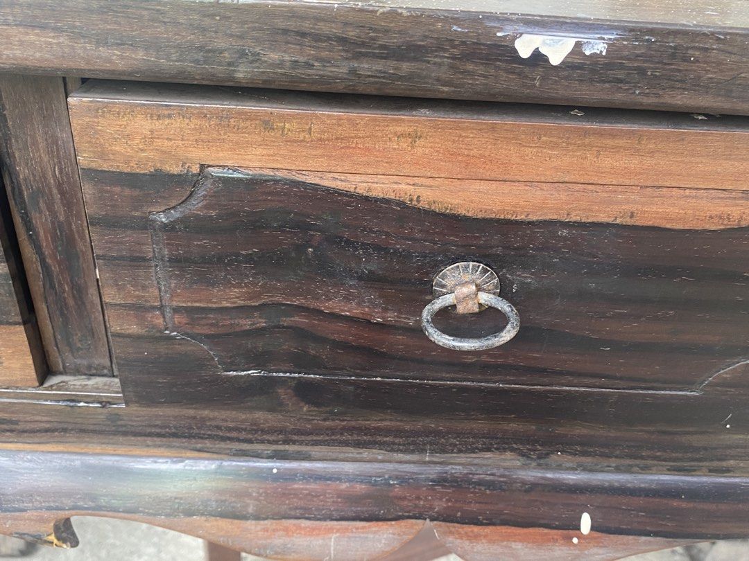 Kamagong console table (sexy legs) (Category: Tables & Sets) located in Malolos. Submitted by jjantiques (Listing ID 1438322694, Image 3). Description: Kamagong console table (sexy legs) - Antique wooden console table - Three drawers with ring pulls - Dark wood finish with visible wood grain - Curved legs - Rectangular tabletop - Decorative drawer edges - Sturdy and well-constructed.