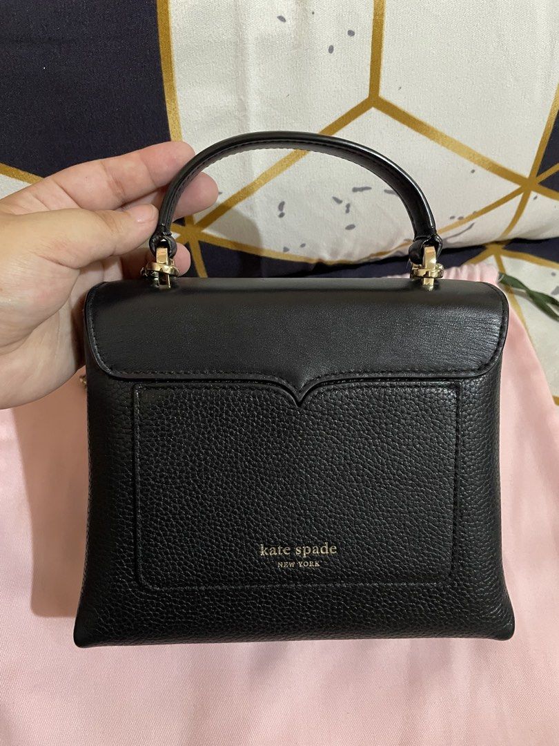 Kate Spade Mini Romy Twistlock Top Handle Bag (Category: Luxury Bags & Wallets) located in Manila. Submitted by twin.trends (Listing ID 1386144551, Image 2). Description: **THIS IS A PRE-LOVED ITEM PLEASE MANAGE YOUR EXPECTATIONS. USED WITH CARE** Includes: Original Dustbag Length: 17.5 cm |Width: 8.5 cm Height: 15 cm | Handle Drop: 5 cm Exterior Material: Leather Interior Material: Suede Shoulder Strap: 56 cm Color: Black.