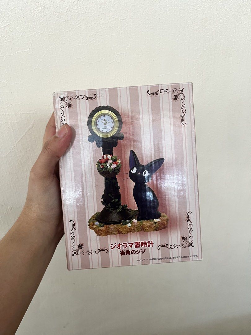 Kiki's Delivery Service Diorama Clock (Category: Clocks) located in Bulacan. Submitted by nyawnyaww (Listing ID 1438358561, Image 1). Description: - Kiki's Delivery Service diorama clock. - Features Jiji the cat. - Authentic design from Japan. Brandnew.
