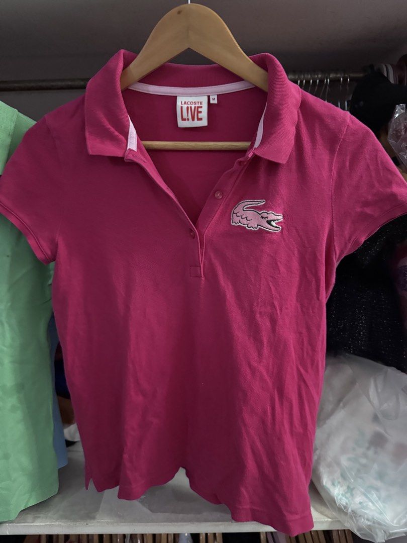 Lacoste Live Polo Shirt - Medium (Category: Tshirts & Polo Shirts ) located in Manila. Submitted by safeshark.4feb32 (Listing ID 1438376604, Image 1). Description: - Authentic Lacoste Live polo shirt - Vibrant pink color - Features the iconic Lacoste crocodile logo - Classic polo collar and button-up placket - Size: Medium - Ideal for casual wear.