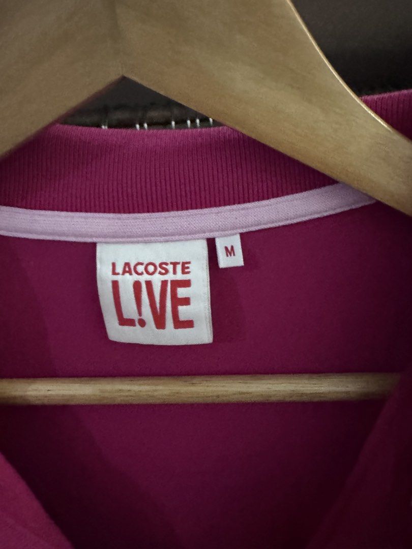 Lacoste Live Polo Shirt - Medium (Category: Tshirts & Polo Shirts ) located in Manila. Submitted by safeshark.4feb32 (Listing ID 1438376604, Image 2). Description: - Authentic Lacoste Live polo shirt - Vibrant pink color - Features the iconic Lacoste crocodile logo - Classic polo collar and button-up placket - Size: Medium - Ideal for casual wear.