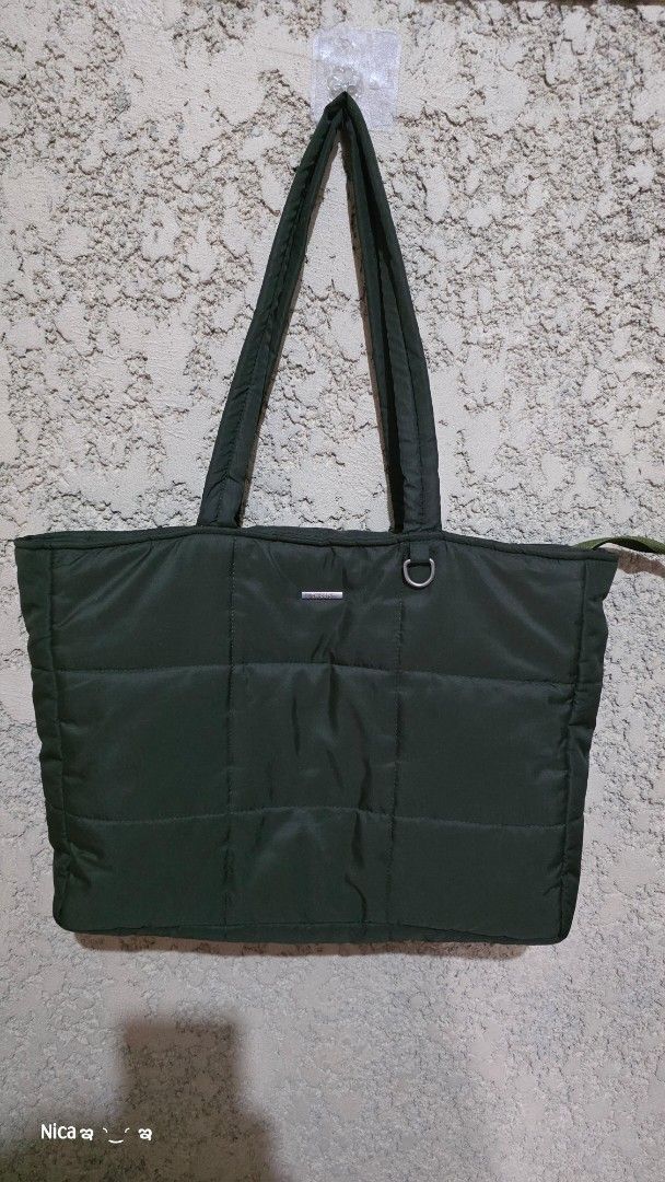 Leoni Tote Bag - Army Green (Category: Tote Bags) located in Quezon City. Submitted by prelovedbox2016 (Listing ID 1438346032, Image 2). Description: - Leoni Tote Bag in Army Green - Made from soft, thick, and water-resistant parachute material - Size: T30cm/P37cm/W9cm - fits laptops up to 14 inches - Weight: 280g - Features: Zipper closure and inner pocket.