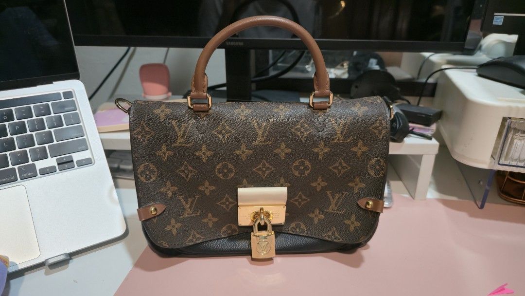 Louis Vuitton Monogram Handbag (Category: Luxury Bags & Wallets) located in Caloocan City. Submitted by sandy119 (Listing ID 1438326659, Image 1). Description: - Authentic Louis Vuitton handbag - Iconic monogram pattern - Top handle design - Secure lock closure - Gold-tone hardware - Black interior - Structured shape - Black leather base.