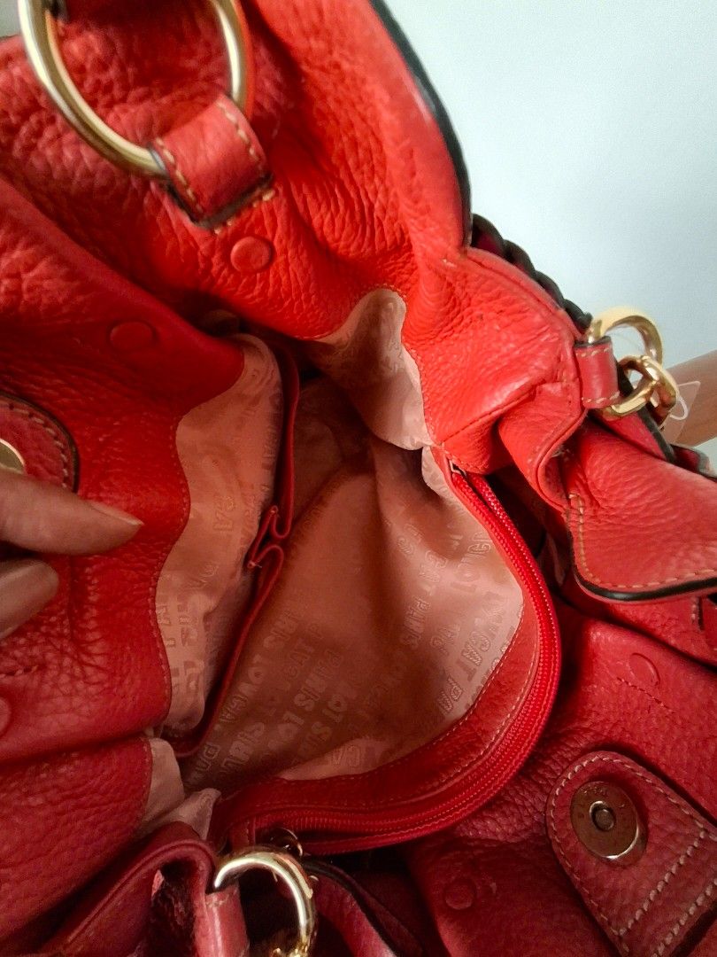 Lovcat Orange Handbag with Braided Detail (Category: Shoulder Bags) located in Quezon City. Submitted by pure_trinsky (Listing ID 1438430362, Image 3). Description: - Stylish orange handbag - Unique braided detail - Top handle and detachable strap - Interior zippered pocket - Two open pockets - Gold-toned hardware - Spacious interior - Textured material.