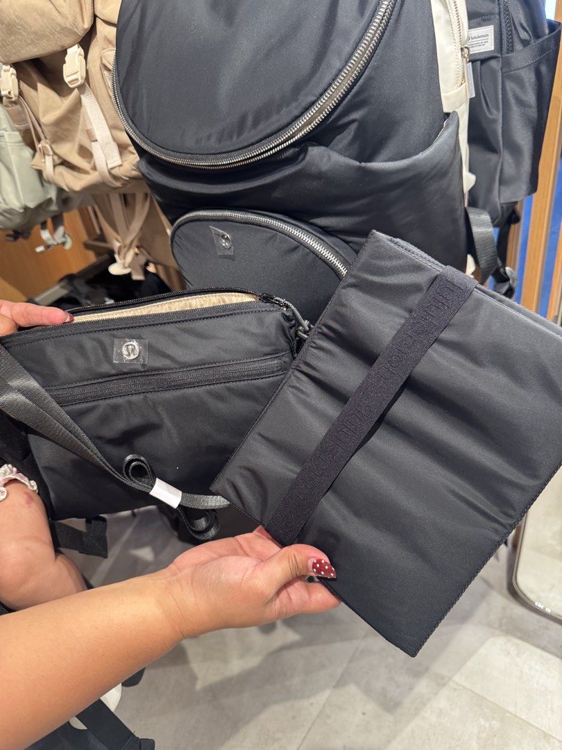 Lululemon New Parent Backpack (Category: Backpacks) located in Bacoor. Submitted by karlarmrz (Listing ID 1438318498, Image 2). Description: - Lululemon New Parent Backpack - Color: Black - Large main compartment - Multiple interior pockets - Includes separate pouch - Includes changing mat - Front zippered pocket - Top handle - Light beige interior lining - Smooth, black exterior material BRAND NEW FROM KOREA EDA MAY 20 Ships from Bacoor or Pasay