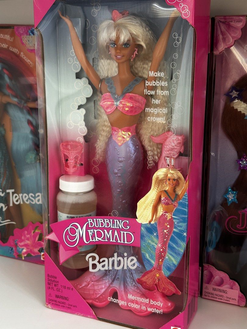Mattel Bubbling Mermaid Barbie Doll (Category: Kids Toys) located in Cavite. Submitted by maria.minerva (Listing ID 1438465324, Image 3). Description: - Brand new Bubbling Mermaid Barbie doll by Mattel. NRFB - Features iconic 90s crimped blonde hair and a pink and purple shimmery mermaid tail. - Tail changes color in water! - Includes bubble solution. - Comes with a magical crown for making bubbles. - Meetup/delivery, DM for more info.