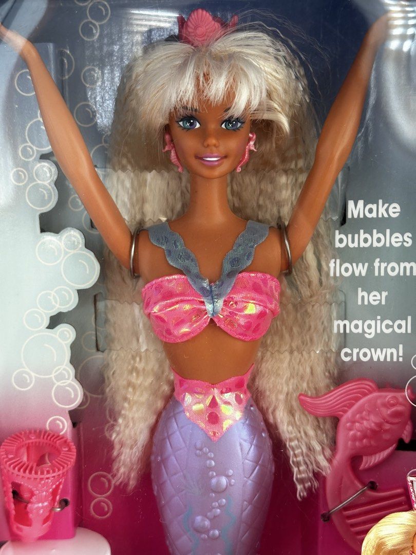 Mattel Bubbling Mermaid Barbie Doll (Category: Kids Toys) located in Cavite. Submitted by maria.minerva (Listing ID 1438465324, Image 2). Description: - Brand new Bubbling Mermaid Barbie doll by Mattel. NRFB - Features iconic 90s crimped blonde hair and a pink and purple shimmery mermaid tail. - Tail changes color in water! - Includes bubble solution. - Comes with a magical crown for making bubbles. - Meetup/delivery, DM for more info.