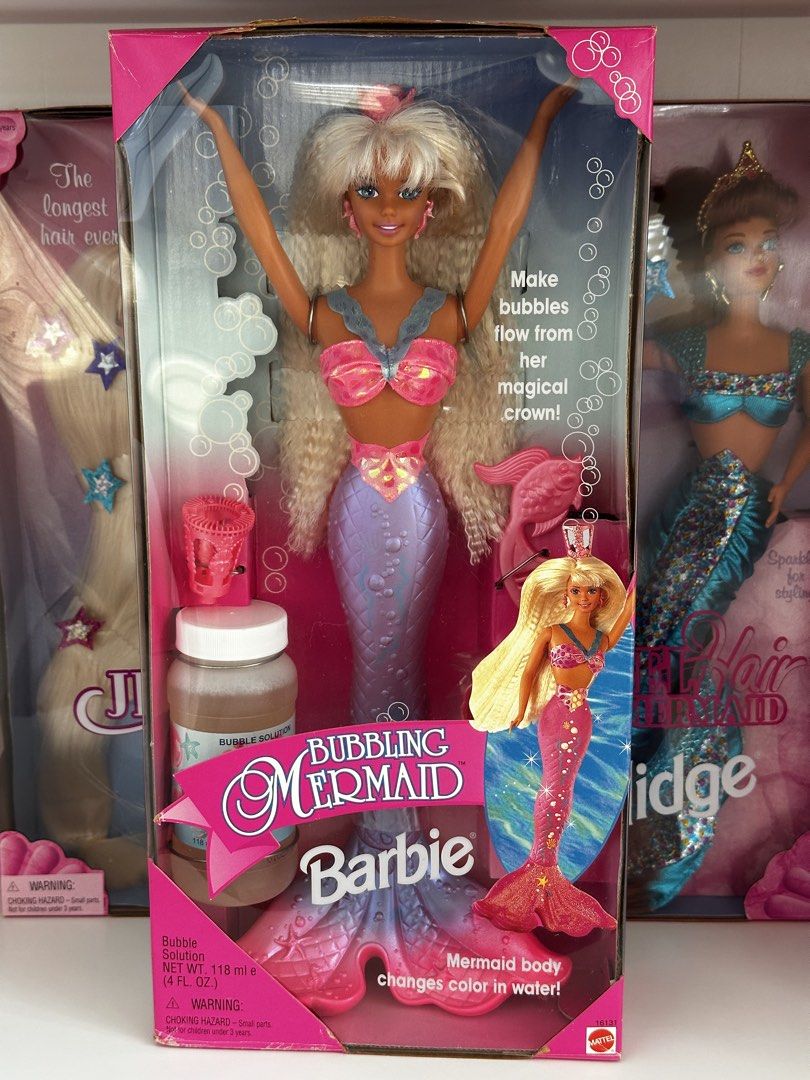 Mattel Bubbling Mermaid Barbie Doll (Category: Kids Toys) located in Cavite. Submitted by maria.minerva (Listing ID 1438465324, Image 1). Description: - Brand new Bubbling Mermaid Barbie doll by Mattel. NRFB - Features iconic 90s crimped blonde hair and a pink and purple shimmery mermaid tail. - Tail changes color in water! - Includes bubble solution. - Comes with a magical crown for making bubbles. - Meetup/delivery, DM for more info.