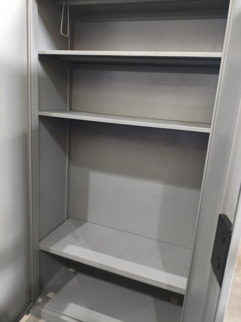 Metal Storage Cabinet with Shelves (Category: Shelves, Cabinets & Racks) located in Manila. Submitted by hmrgrace5. (Listing ID 1438348775, Image 3). Description: - Durable metal storage cabinet - Grey finish - Double doors - Multiple shelves for ample storage - Ideal for tools, documents, and belongings - Simple design - Easy to clean 35x18x71in.