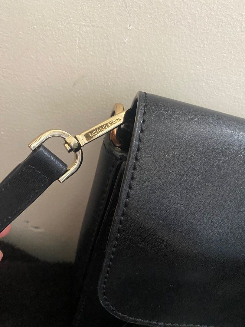 Michael Kors Black Crossbody Bag (Category: Luxury Bags & Wallets) located in Paete. Submitted by ladder_leynn (Listing ID 1438322548, Image 3). Description: - Black Michael Kors crossbody bag - Gold-tone hardware - Flap closure with logo detail - Adjustable shoulder strap - Interior zippered pocket - Made of leather - Back pocket -authenticity not guaranteed negotiable price.