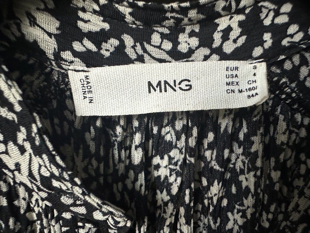 MNG Floral Dress - Size S (Category: Dresses) located in Malabon City. Submitted by igigs (Listing ID 1438457719, Image 2). Description: - MNG floral dress - Size: S - Print: Black and white floral - Features: Long sleeves, shirred waist, button-down front, ruffled hem - Made in China - Measurements: Shoulder - 16", Length - 38".