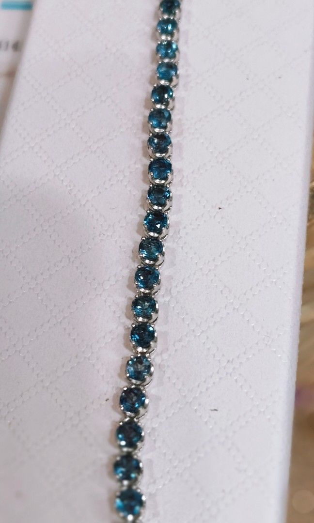 Natural topaz Bracelet w/ Cert.925 Silver (Category: Bracelets) located in Davao. Submitted by zinbad (Listing ID 1438452338, Image 1). Description: "An elegant diamond bracelet adorned with radiant blue topaz stones, combining timeless luxury with a serene ocean-blue sparkle. The brilliant diamonds enhance the beauty of each gemstone, creating a graceful and sophisticated piece perfect for any occasion.".