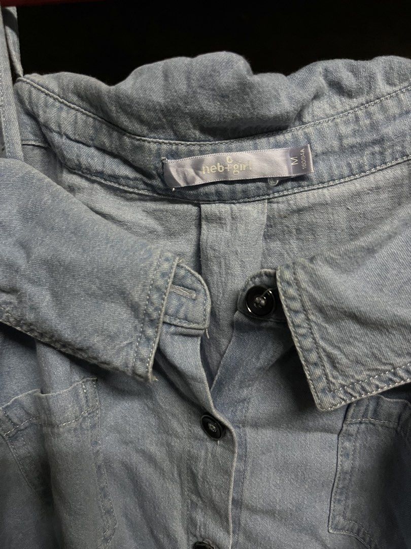 Neb Girl Off-Shoulder Denim Top - Medium (Category: Others Tops) located in Taguig. Submitted by misguidedghost (Listing ID 1438470510, Image 2). Description: Light Denim Off-shoulder Blouse Brand: neb+girl Size: M - Neb Girl off-shoulder denim top - Medium size - Button-down front - Short sleeves - Chest pocket - Unique collar design - Made of denim - Perfect for a casual chic look.