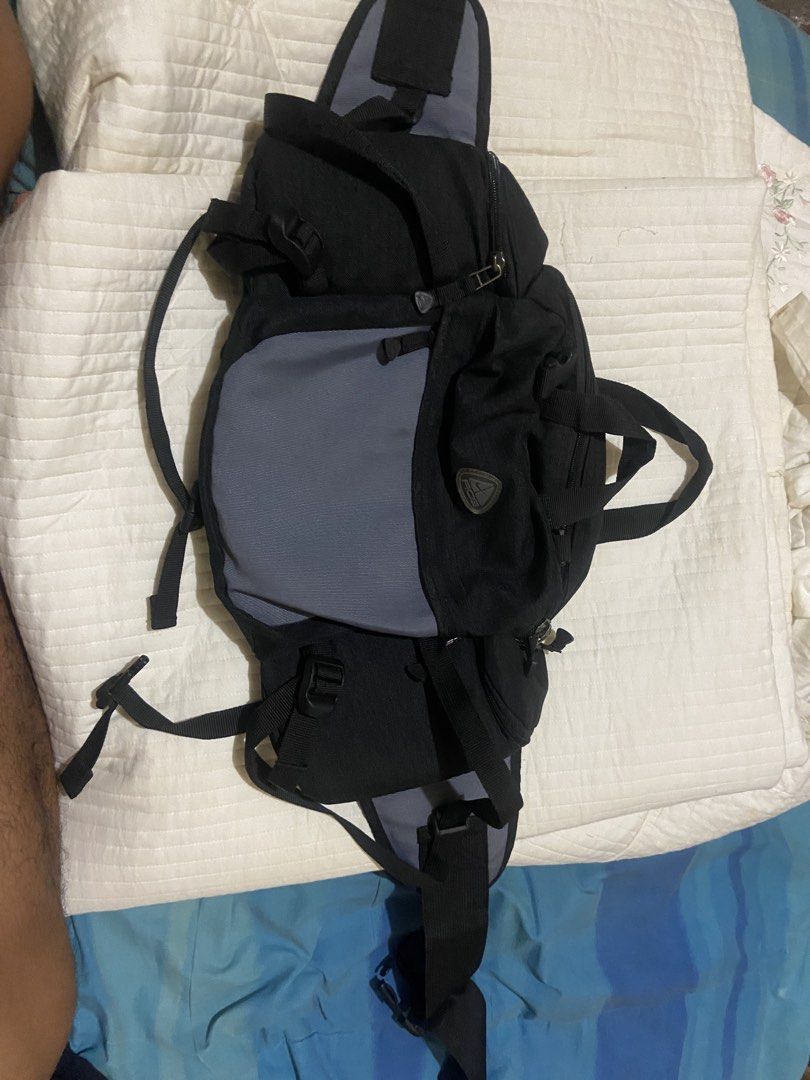 Nike ACG Backpack (Category: Backpacks) located in Don Carlos. Submitted by doubleethrifted (Listing ID 1438444413, Image 2). Description: - Nike ACG backpack - Color: Black and Gray - Multiple compartments for storage - Adjustable straps for a comfortable fit - Top handle for easy carrying - Secure buckle closure - ACG logo detailing - Ideal for outdoor activities.