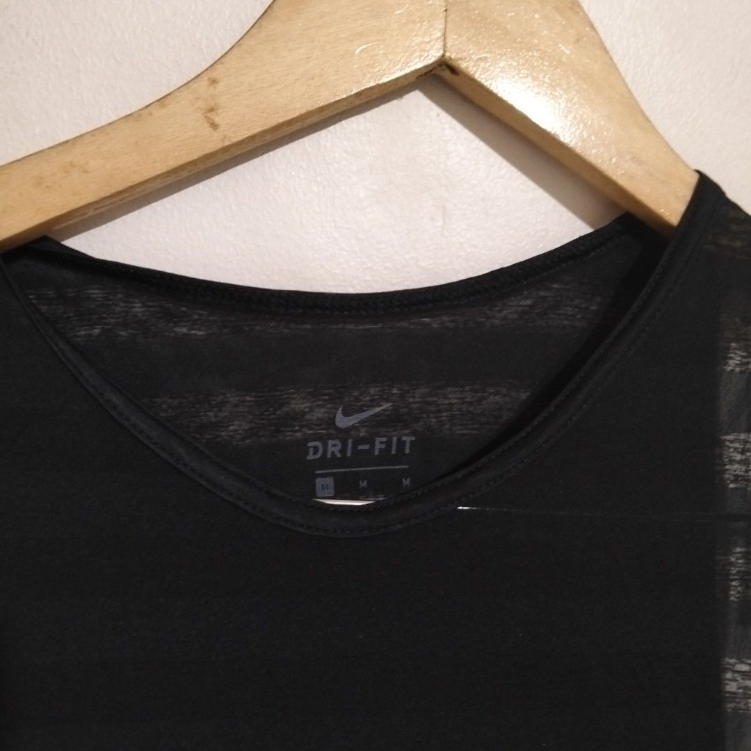 Nike Dri-FIT Black Tank Top M (Category: Activewear) located in Subic. Submitted by tintindera (Listing ID 1438433054, Image 2). Description: - Black Nike Dri-FIT tank top - Features Nike logo - Dri-FIT technology for moisture-wicking - Mesh design on upper part - Solid fabric on lower part - V-neck style - Size: M-L.