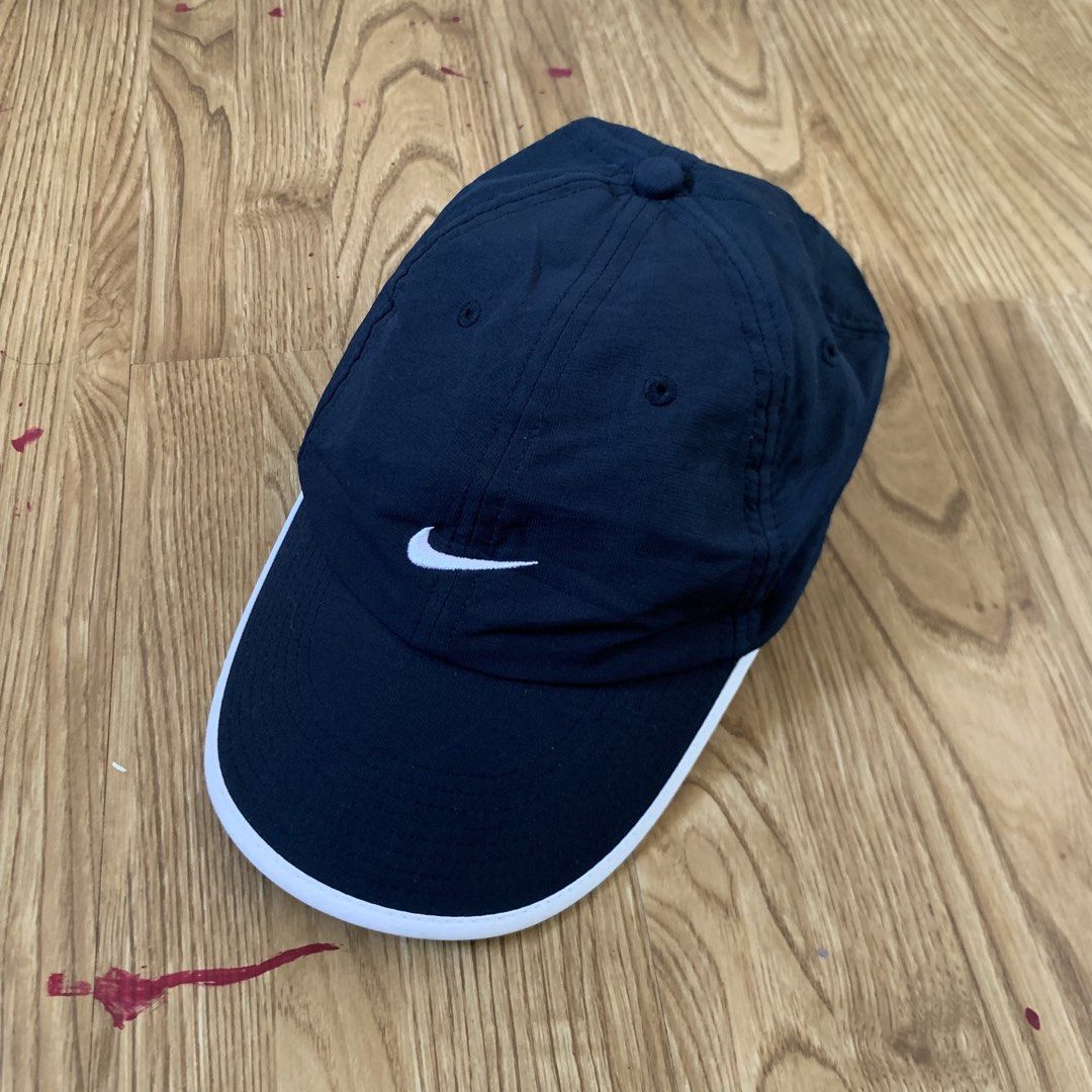 Nike Fit Dry Cap (Category: Caps & Hats) located in Cebu City. Submitted by zen.lasonking (Listing ID 1438449798, Image 1). Description: - Navy blue Nike cap - White Nike logo on front - White trim on brim - Adjustable strap with Nike Fit logo - Size: 56/58cm - Material: 100%.
