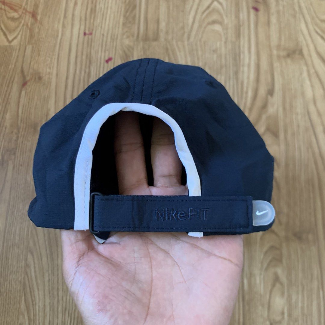 Nike Fit Dry Cap (Category: Caps & Hats) located in Cebu City. Submitted by zen.lasonking (Listing ID 1438449798, Image 3). Description: - Navy blue Nike cap - White Nike logo on front - White trim on brim - Adjustable strap with Nike Fit logo - Size: 56/58cm - Material: 100%.
