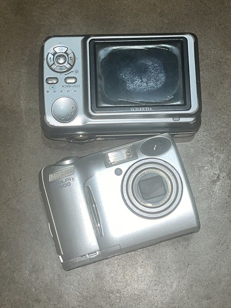 Nikon Coolpix & Fujifilm FinePix untested cams (Category: Cameras) located in Quezon City. Submitted by charitydonations (Listing ID 1438327019, Image 2). Description: - Silver digital cameras available. - Camera 1: Nikon Coolpix 500 with zoom lens. - Camera 2: Fujifilm FinePix with 6.3 megapixels. - Both cameras are untested. No batteries included purchase your own.
