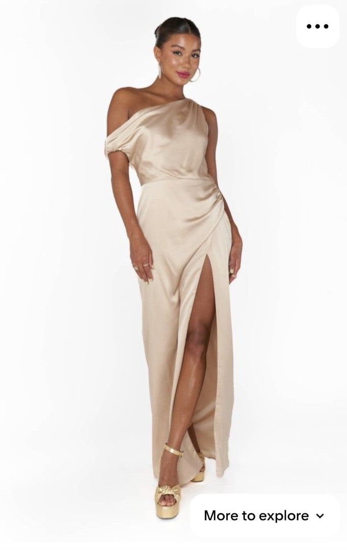 One-Shoulder Satin Maxi Dress (Category: Dresses) located in Lipa City. Submitted by kathethings (Listing ID 1438321315, Image 2). Description: - Elegant champagne maxi dress - One-shoulder design - Flattering draped neckline - High slit - Fitted bodice, flowing skirt - Smooth, satin-like fabric - Ideal for special events A 36-inch bust and 30-inch waist Women's Size 10 Medium to Large in standard apparel sizing..