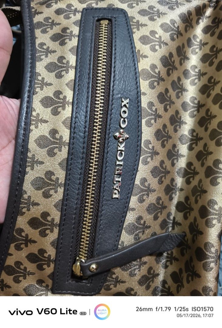 Patrick Cox Crossbody Bag (Category: Luxury Bags & Wallets) located in Pasay City. Submitted by cory0223 (Listing ID 1438409587, Image 2). Description: - Patrick Cox crossbody bag - Unique pattern - Adjustable strap - Zippered front pocket - Interior zippered pocket Guaranteed Original Source Japan.