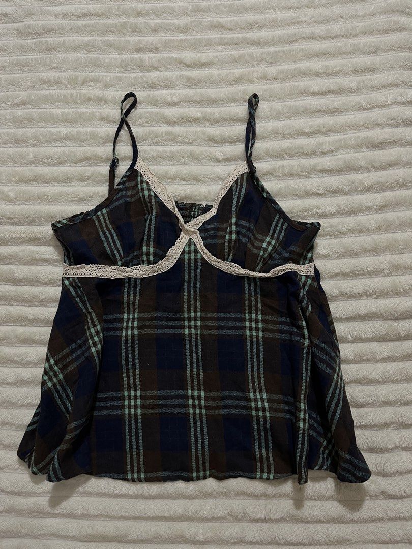 Plaid Cami Top with Lace Trim (Category: Sleeveless) located in Angeles City. Submitted by deyninazd (Listing ID 1438454410, Image 2). Description: - Plaid cami top - Colors: Blue, brown, and green - Delicate spaghetti straps - Lace trim neckline - Elasticated back for a comfortable fit - Stylish and versatile.