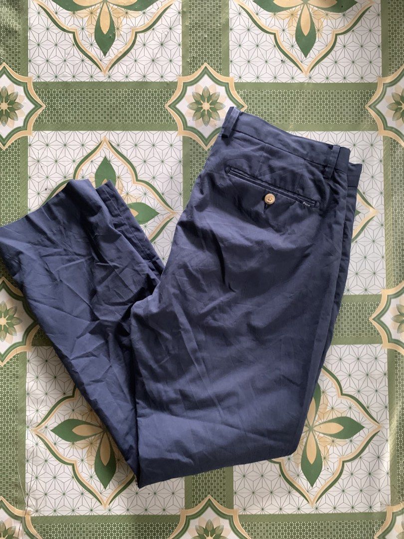 Polo Ralph Lauren Slim Fit Pants (Category: Jeans) located in Manila. Submitted by pole.thirft (Listing ID 1438393604, Image 1). Description: - Navy blue Polo Ralph Lauren slim fit pants - Button closure and zipper - Classic design - Polo logo on back pocket - Material and supplier information on tag - Suitable for various occasions.
