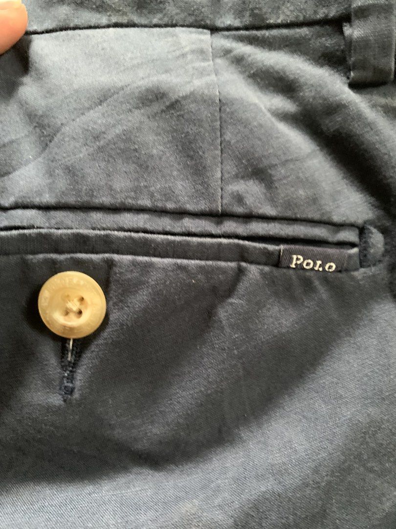 Polo Ralph Lauren Slim Fit Pants (Category: Jeans) located in Manila. Submitted by pole.thirft (Listing ID 1438393604, Image 2). Description: - Navy blue Polo Ralph Lauren slim fit pants - Button closure and zipper - Classic design - Polo logo on back pocket - Material and supplier information on tag - Suitable for various occasions.