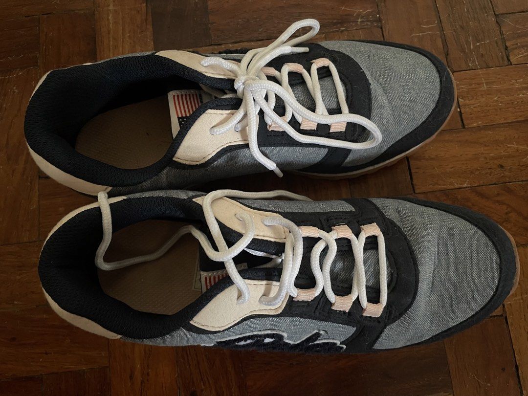 Polo Ralph Lauren Sneakers (Category: Sneakers) located in Mandaluyong City. Submitted by cesca2003 (Listing ID 1438358362, Image 2). Description: - Polo Ralph Lauren sneakers - Color: Grey, Black, and Beige - Size: 3.5 UK / 3 / 34.5 EUR / 23.1 cm - Features the iconic Polo logo - Made in Vietnam - White laces and brown sole.