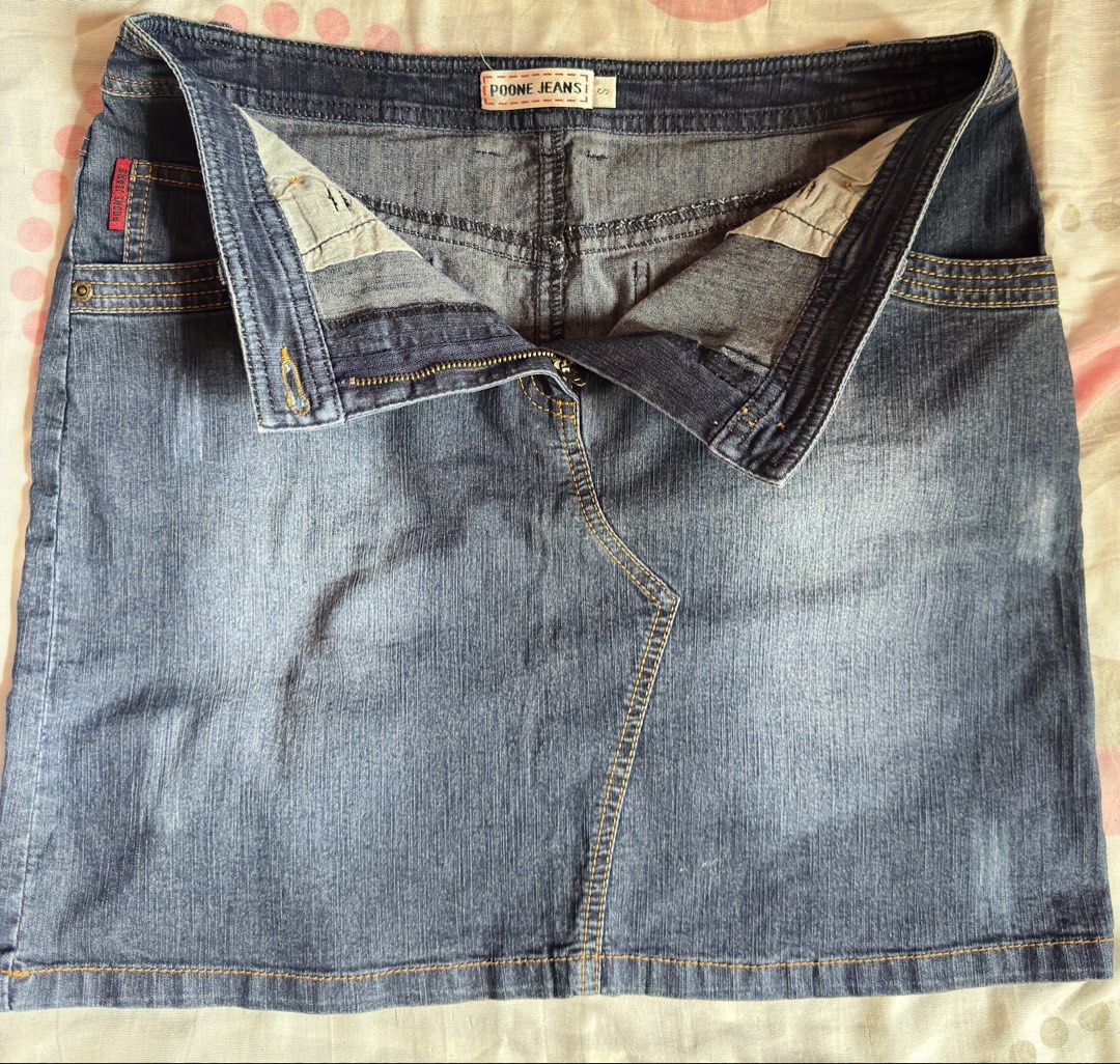 Poone Jeans Denim Skirt (Category: Skirts) located in Manila. Submitted by fidelle_r (Listing ID 1438339968, Image 2). Description: - Poone Jeans denim skirt - Classic design - Medium wash - Button and zipper closure - Front and back pockets - Unique seam detail - Five-pocket design - Ideal for casual outfits.