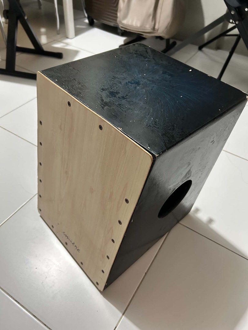 Premier Beatbox Percussion Instrument (Category: Musical Instruments) located in Pasig City. Submitted by shopsxfinds (Listing ID 1438321037, Image 2). Description: - Wooden cajon with a light wood grain front panel - Black body - Features a sound hole - Includes tuning knobs - Ready to play.