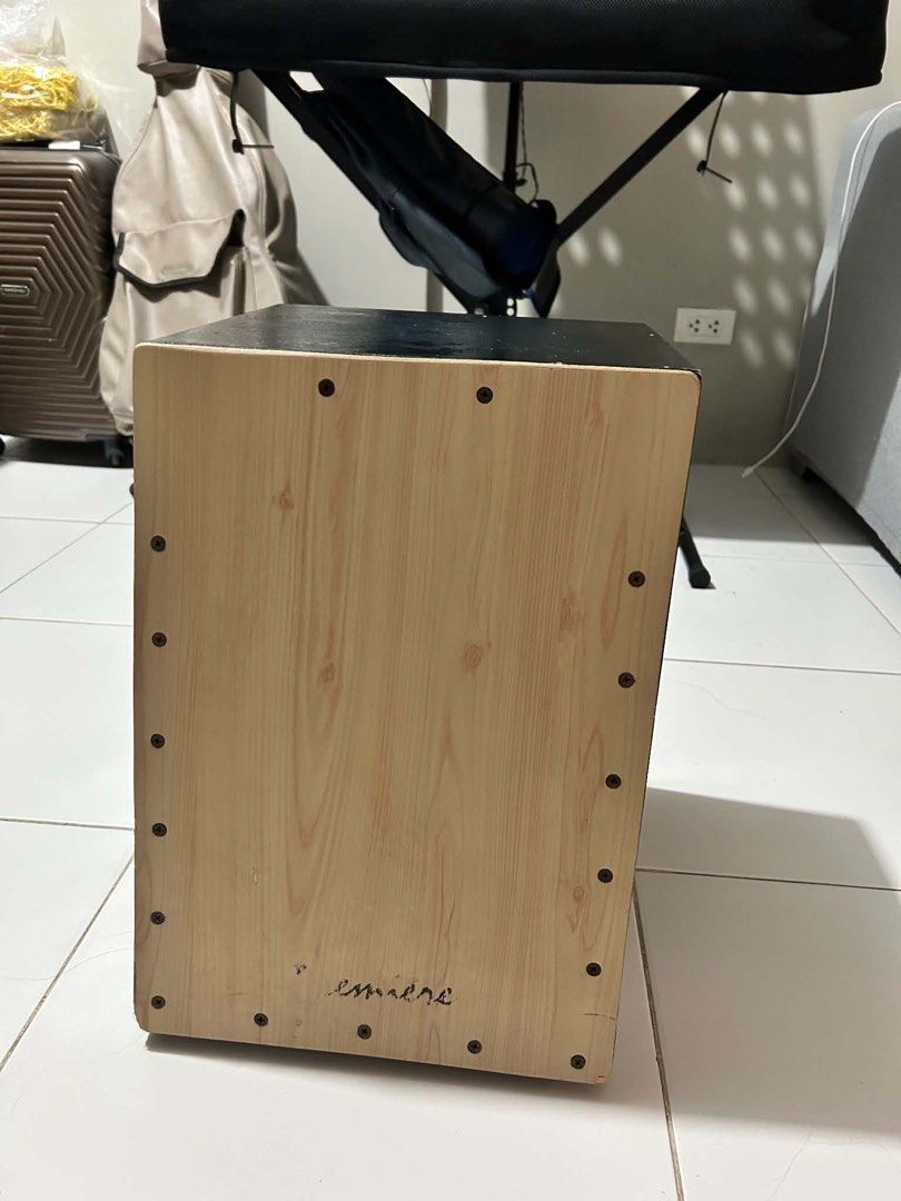 Premier Beatbox Percussion Instrument (Category: Musical Instruments) located in Pasig City. Submitted by shopsxfinds (Listing ID 1438321037, Image 1). Description: - Wooden cajon with a light wood grain front panel - Black body - Features a sound hole - Includes tuning knobs - Ready to play.