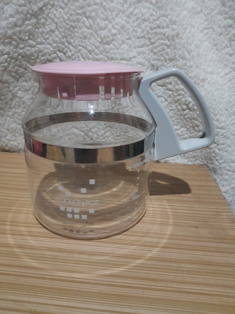 Pyrex Coffee Carafe (Category: Coffee & Tea Tableware) located in Bocaue. Submitted by marajapansurplus (Listing ID 1438420257, Image 1). Description: - Vintage Pyrex coffee carafe - Clear glass body - Pink lid - Gray handle - Silver band detail - Measurement markings - Pyrex logo - Made in Japan.