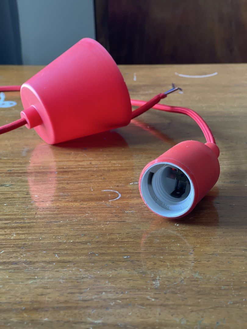 Red Pendant Lamp Holder (Category: Lighting) located in Pasay City. Submitted by theclutterfree (Listing ID 1438320349, Image 2). Description: - Red pendant lamp holder - Includes E27 socket - Comes with ceiling canopy - Features a stylish red fabric-covered wire - Suitable for various lighting applications.