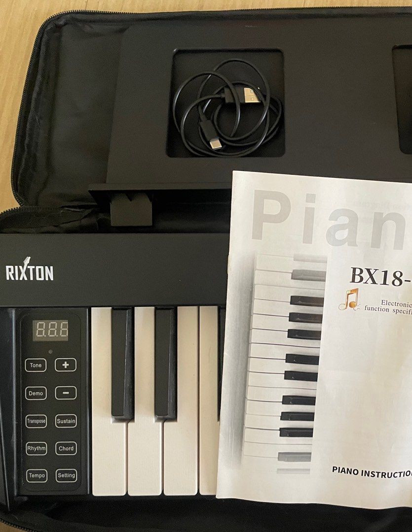 Rixton Foldable Piano (Category: Musical Instruments) located in Manila. Submitted by epicriver-b00d (Listing ID 1438324066, Image 1). Description: A foldable piano with bluetooth functions. brand: Rixton Comes with: Case Sustain pedal Manual Note Sheet stand (with The battery runs out fast, so use it while charging.).