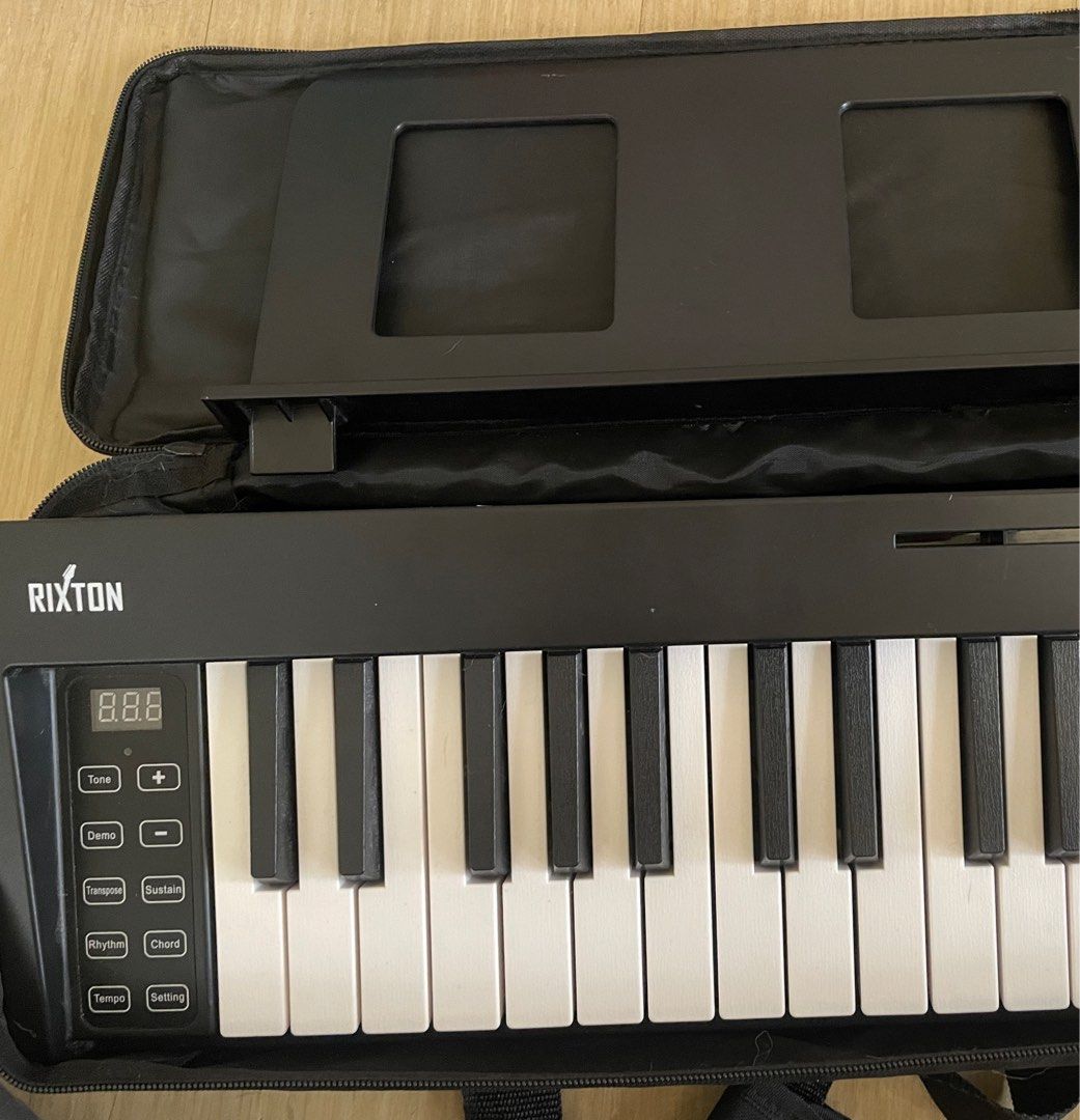 Rixton Foldable Piano (Category: Musical Instruments) located in Manila. Submitted by epicriver-b00d (Listing ID 1438324066, Image 3). Description: A foldable piano with bluetooth functions. brand: Rixton Comes with: Case Sustain pedal Manual Note Sheet stand (with The battery runs out fast, so use it while charging.).