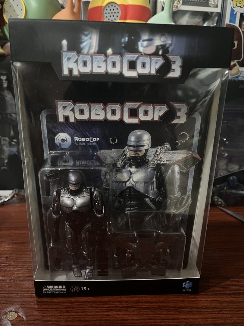 RoboCop 3 Action Figure (Category: Figurines & Statues) located in San Pedro. Submitted by btoyzz (Listing ID 1438430714, Image 1). Description: - Hiya Toys RoboCop 3 action figure - 1/18 scale - Brand new, in original packaging - Box features RoboCop figure images - Includes manufacturer and copyright details on the box - Recommended for ages 15+.