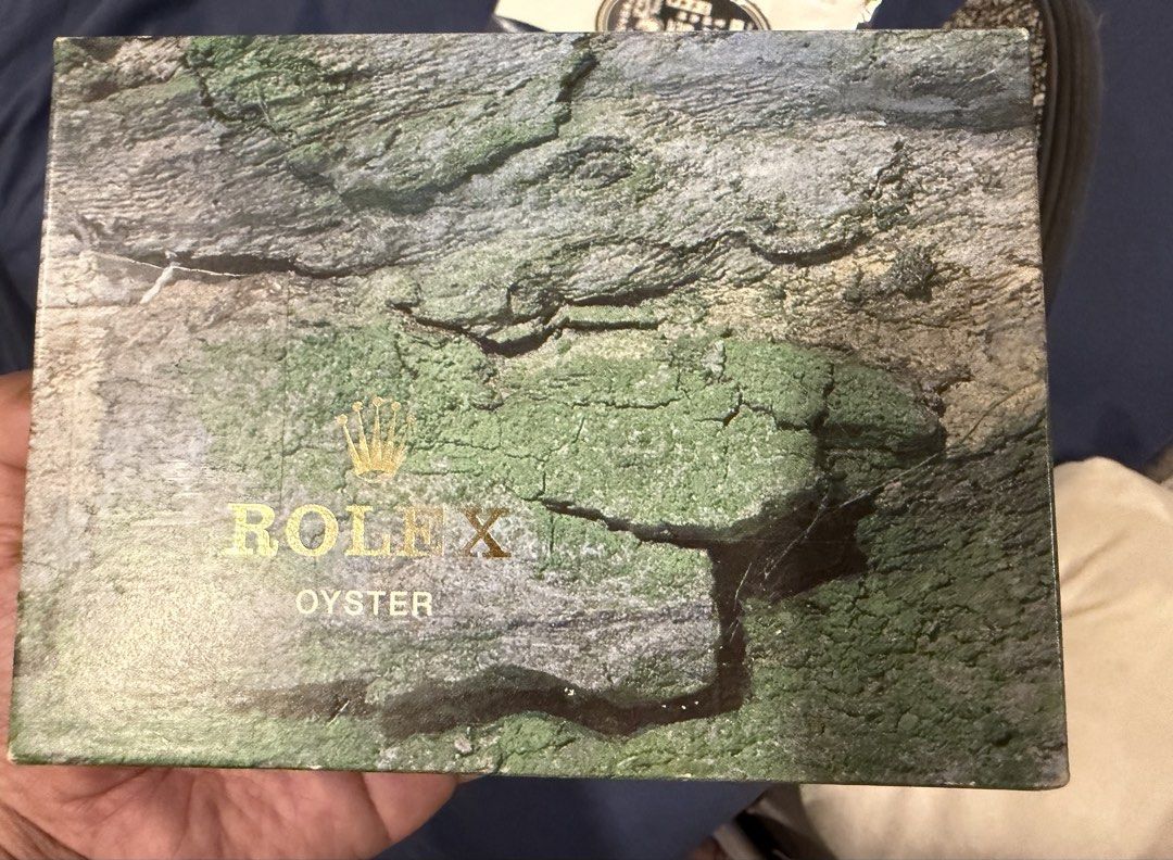 Rolex Oyster Watch Box (Category: Luxury Watches) located in Quezon City. Submitted by dimsum79 (Listing ID 1438432430, Image 1). Description: - Rolex Oyster outer box only - Textured, bark-like design - Features Rolex logo and text Price: 6300.