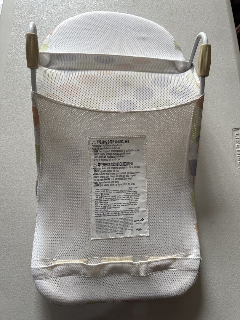 Safety 1st Bath Support (Category: Bathtub & Bath Accessories) located in Quezon City. Submitted by things2things (Listing ID 1438313648, Image 3). Description: - Safety 1st bath support - Colorful patterned fabric - Curved design for baby's comfort - Mesh back for support - Sturdy white frame - Adjustable features - Designed to fit standard baby bathtubs.