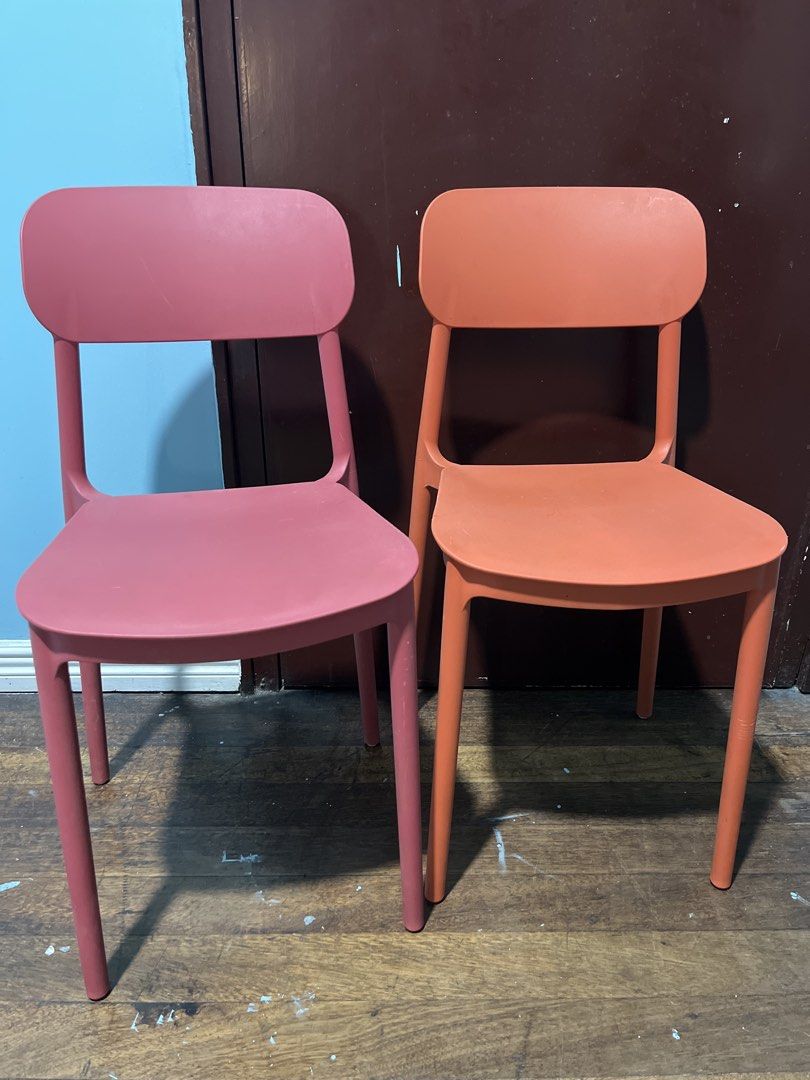 Set of Two Modern Dining Chairs (Category: Chairs) located in San Juan City. Submitted by superash (Listing ID 1438487388, Image 1). Description: - Set of 2 modern dining chairs - Colors: Pink and Orange - Minimalist design - Curved backrest and seat - Solid material, four legs - Ideal for dining room or kitchen.