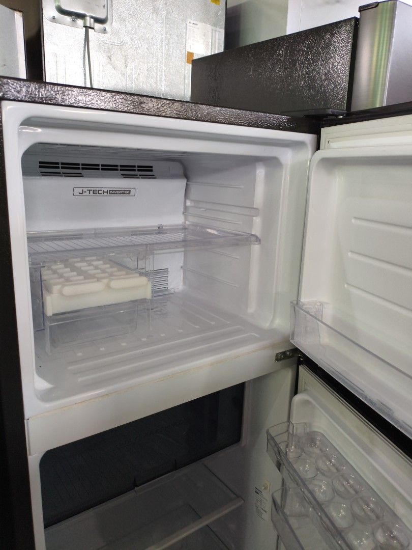 Sharp Two-Door Refrigerator with J-Tech Inverter (Category: Refrigerators and Freezers) located in Manila. Submitted by hmrgrace5. (Listing ID 1438347448, Image 2). Description: - Sharp two-door refrigerator - J-Tech Inverter technology - Stainless steel finish - Multiple shelves and door compartments - Built-in ice maker - Clean and well-maintained interior.