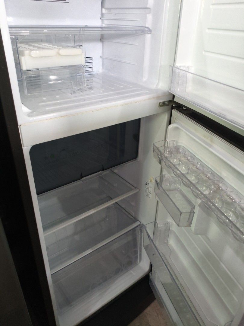Sharp Two-Door Refrigerator with J-Tech Inverter (Category: Refrigerators and Freezers) located in Manila. Submitted by hmrgrace5. (Listing ID 1438347448, Image 3). Description: - Sharp two-door refrigerator - J-Tech Inverter technology - Stainless steel finish - Multiple shelves and door compartments - Built-in ice maker - Clean and well-maintained interior.