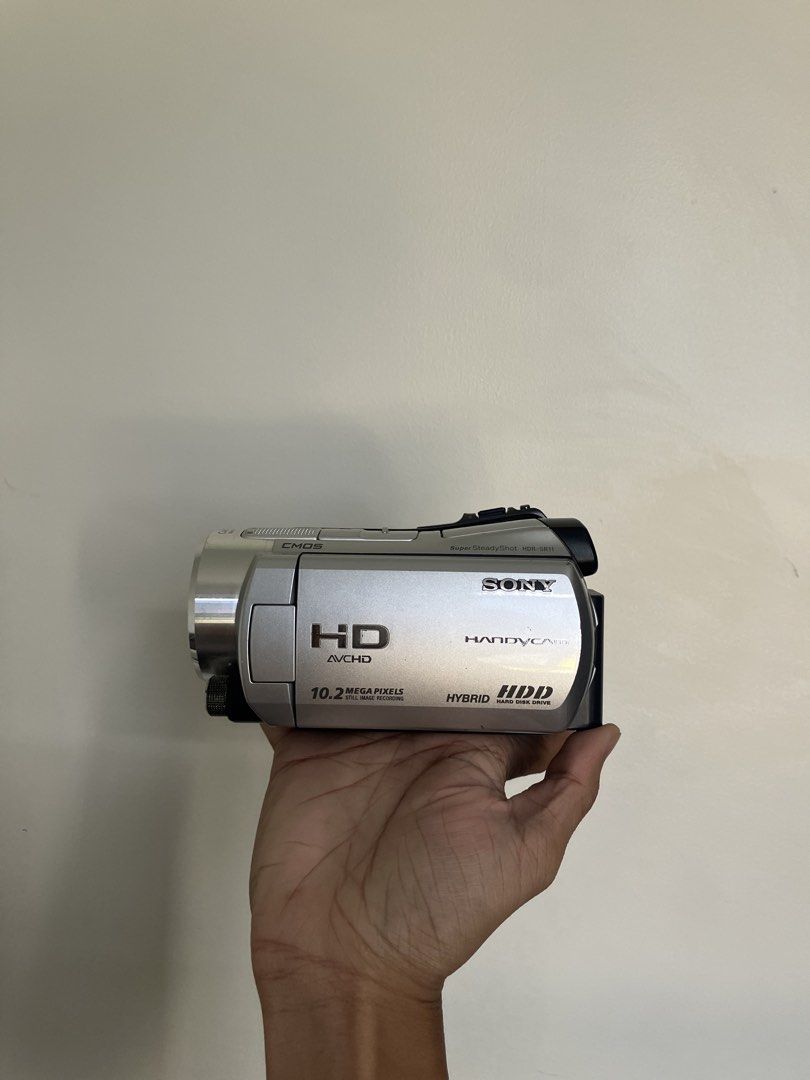 Sony Handycam HDR-SR11 Camcorder (Category: Video Cameras) located in Pasig City. Submitted by findshyt (Listing ID 1438433996, Image 1). Description: - Sony Handycam - HD video recording - 10.2MP still photos - Hybrid HDD 60gb storage - Carl Zeiss lens - 12x zoom - Black and silver color - Includes Sony hand strap - Night vision - Comes with battery, charger and cables - Ready to use ₱13,000 Can do shipping and same day delivery thru lalamove DM