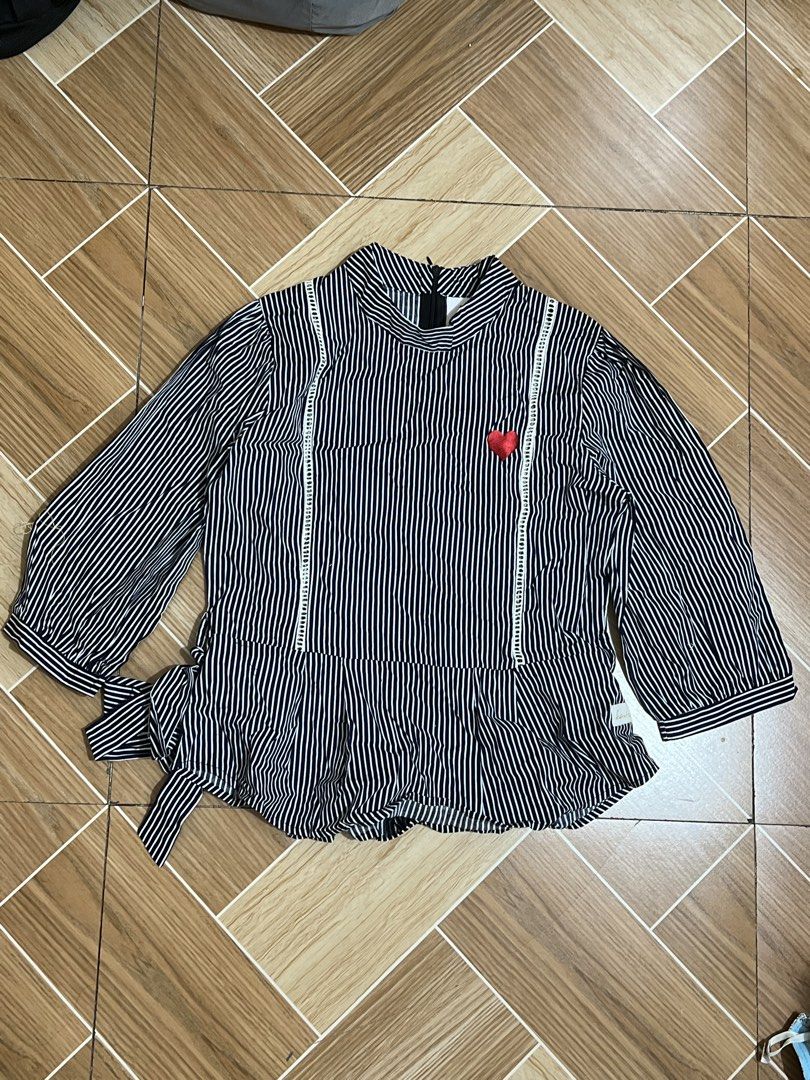 Striped Blouse with Heart Detail (Category: Blouses) located in Baguio. Submitted by izzy1234123 (Listing ID 1438356969, Image 1). Description: - Black and white striped pattern - High neckline - Long sleeves - Side tie detail - Embroidered red heart - Peplum hemline - Back zipper closure.